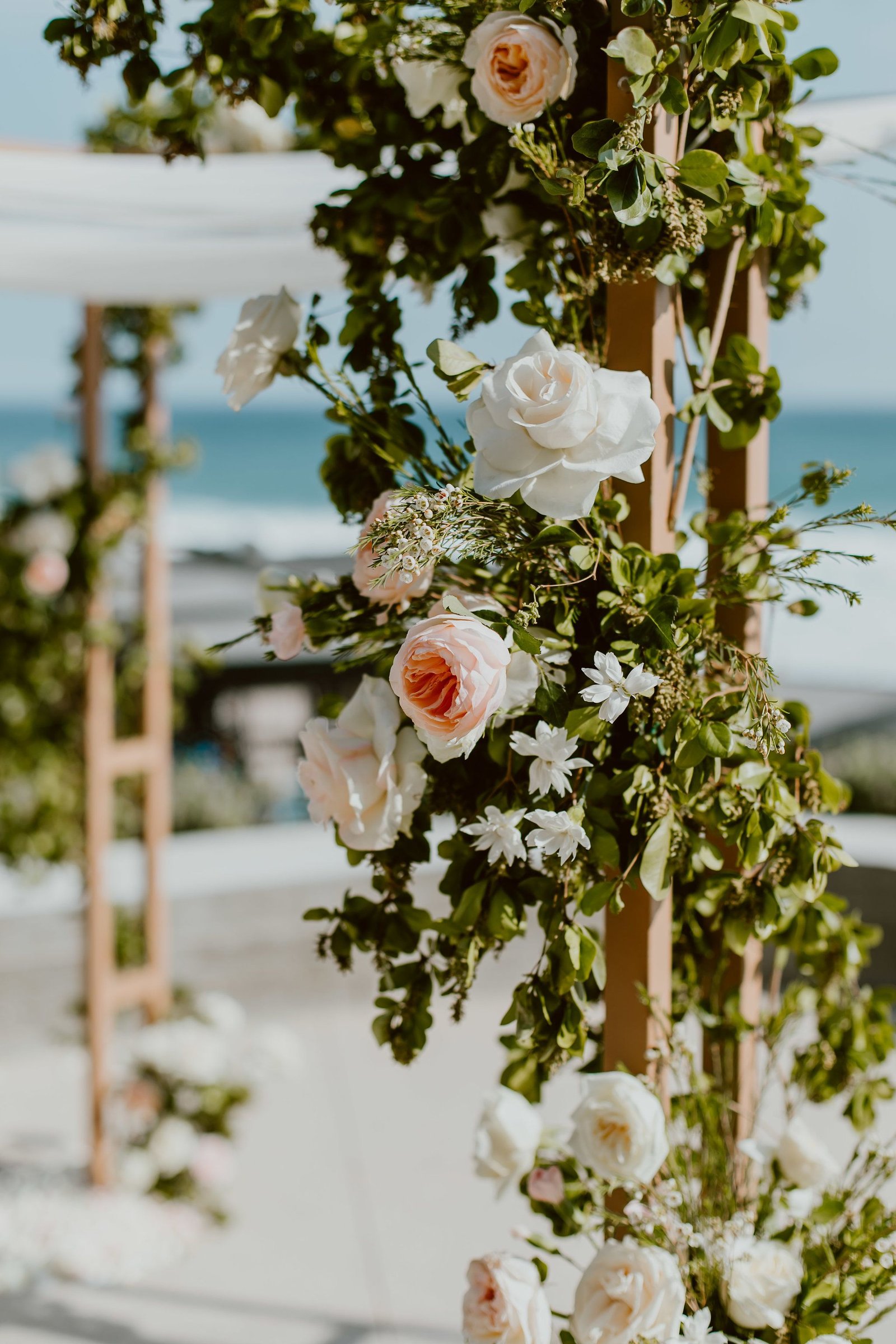 Flower details of roses, Peonies, Ranunculus and greenery for dana and JJ´s wedding at The Cape, by Thompson Hotels. Lola from Florenta Flower Design did this ceremony alter. Wedding Planning by Cabo Wedding Services