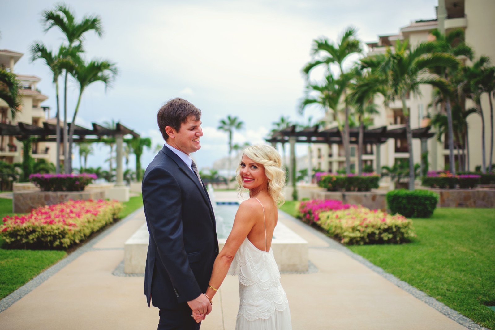 Bride and groom getting photo session at Villa de la Estancia in Cabo San Lucas, Mexico, right before their Wedding Ceremony at their Destination Wedding in Mexico. Wedding Planning by Cabo Wedding Services.