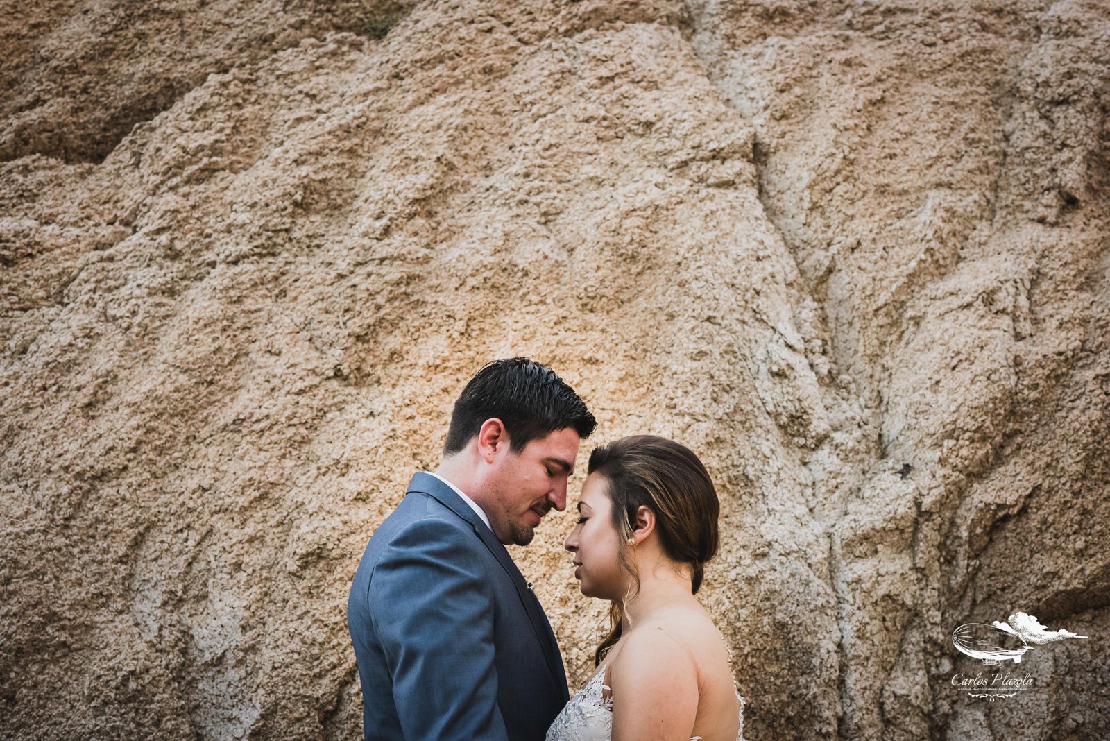Bride and groom kissing each other and hanging out prior to the ceremony, just getting some together time. They were such a sweet couple and the ceremony took place at Wedding Venue Grand Fiesta Americana Los Cabos. Wedding planning and design by Cabo Wedding Services