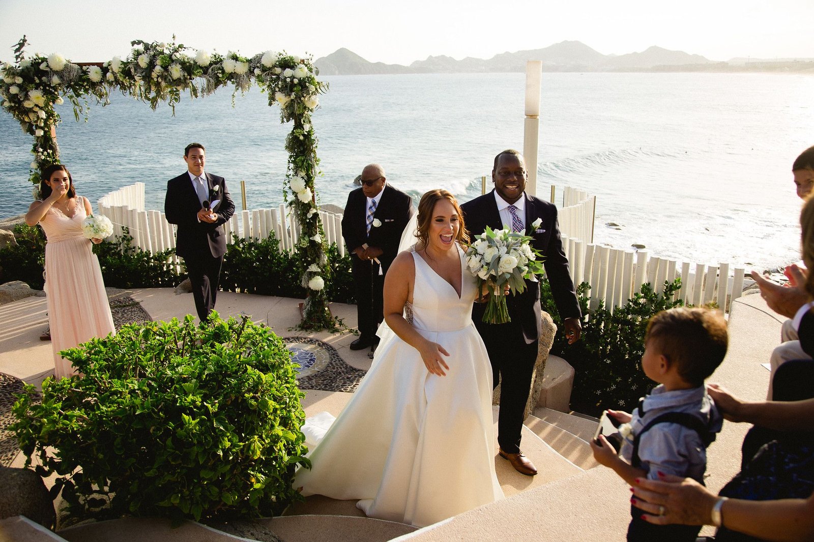 Bride and groom after wedding ceremony at Wedding Venue in Cabo San Lucas Sunset da Mona Lisa. Wedding planning and design by Cabo Wedding Services