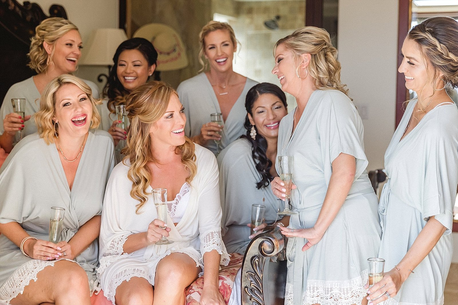 Bride drinking Champagne with her Bridesmaids at Hacienda Encantada in Cabo San Lucas, Mexico. Wedding Planning by Cabo Wedding Services and the Wedding took place at Flora Farms.