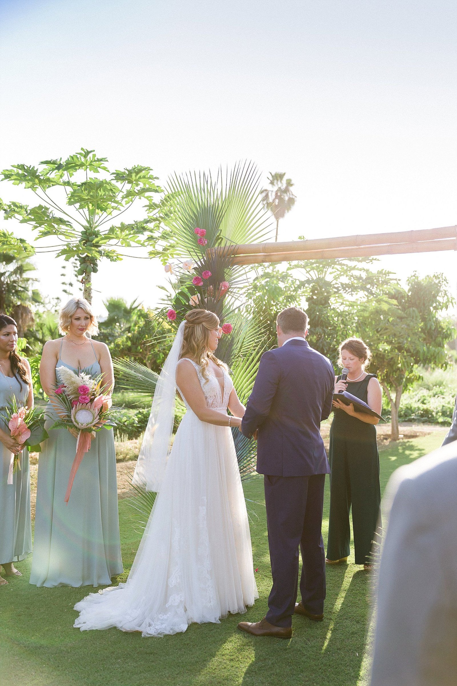 Bride and Groom standing at the front during Wedding Ceremony at Flora Farms in Los Cabos Mexico. Wedding Planning by Cabo Wedding Services and Photography by Sara Richardson