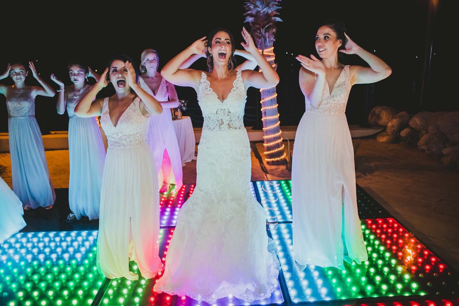 Bride dancing with her bridesmaids on LED dance floor. They had such a good time on Jessica's wedding day at Villa del Palmar in Los Cabos, Mexico.