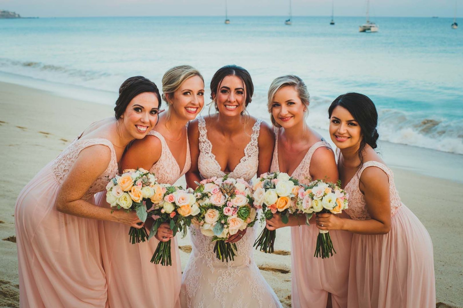 Bride with Bridesmaids in Los Cabos Mexico, during a photo session after her wedding ceremony at the Evangelista church, located downtown Cabo San Lucas, Mexico.