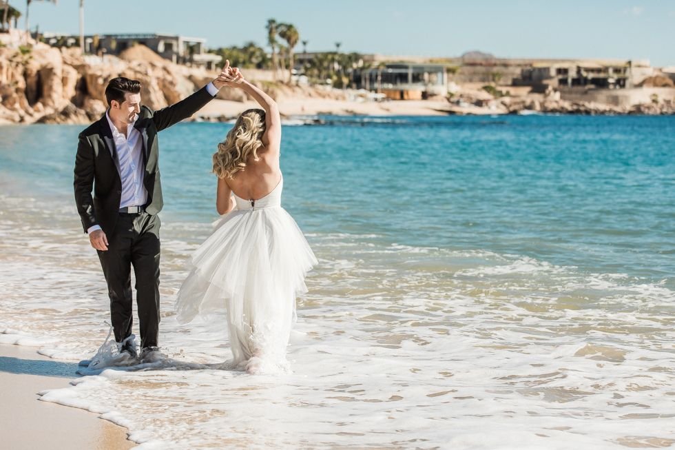 Bride and Groom photo Session at The Cape. Cabo Wedding Planning by Cabo Wedding Services. Photography done by local Photographer Daniel Jireh.