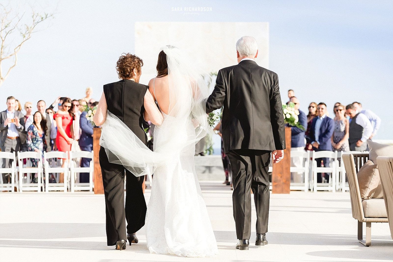 Bride walking down to her Groom during the Wedding Ceremony at LeBlanc in Los Cabos Mexico.