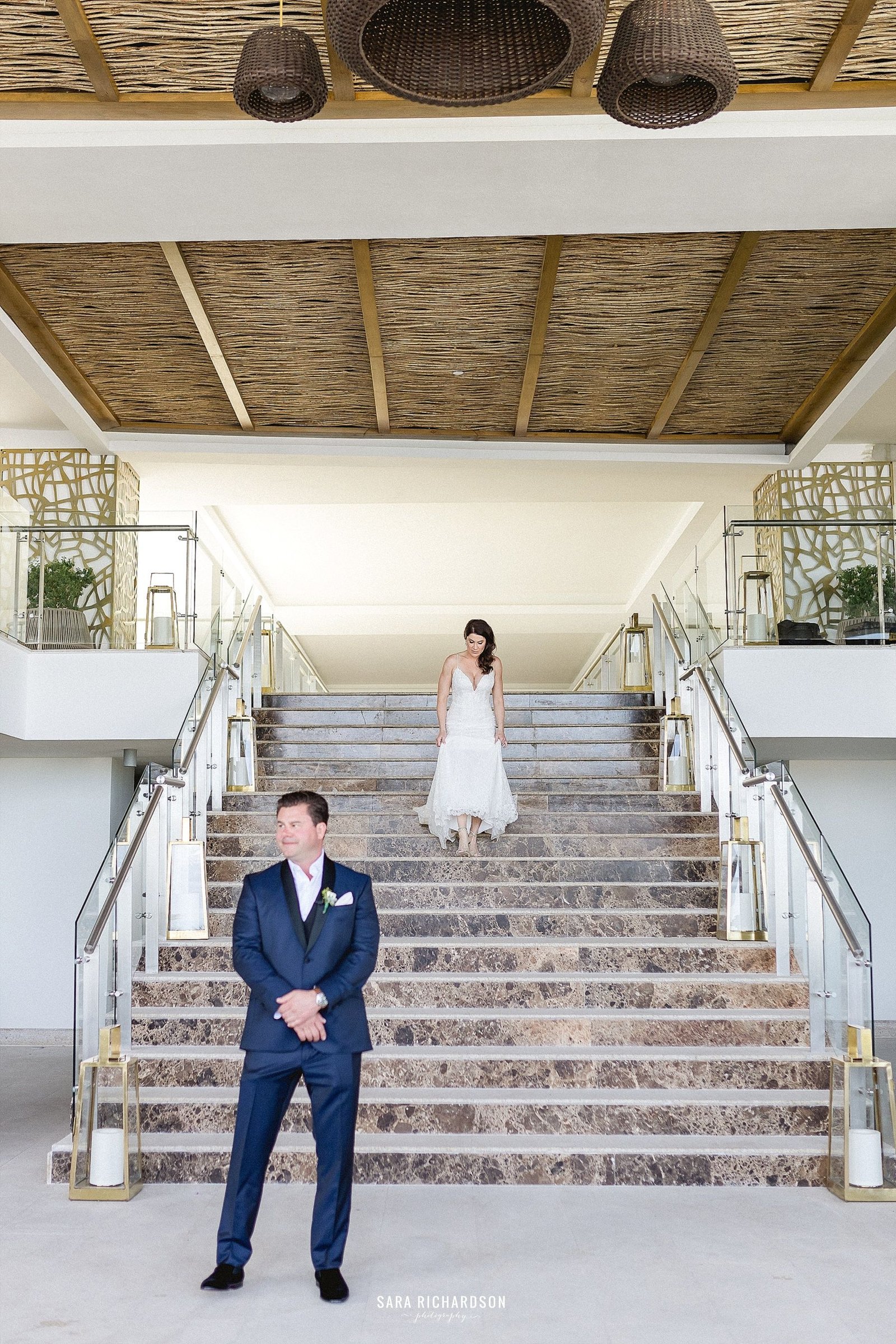 Our Bride and Groom decided to do a First Look right before the ceremony to get some more special moments before their wedding ceremony. They had such a great time doing this, and they both looked amazing! Thank you to Jimmy Choo shoes for making our Bride look amazing and making her legs look beautiful as she was walking down the stairs to do her first look!