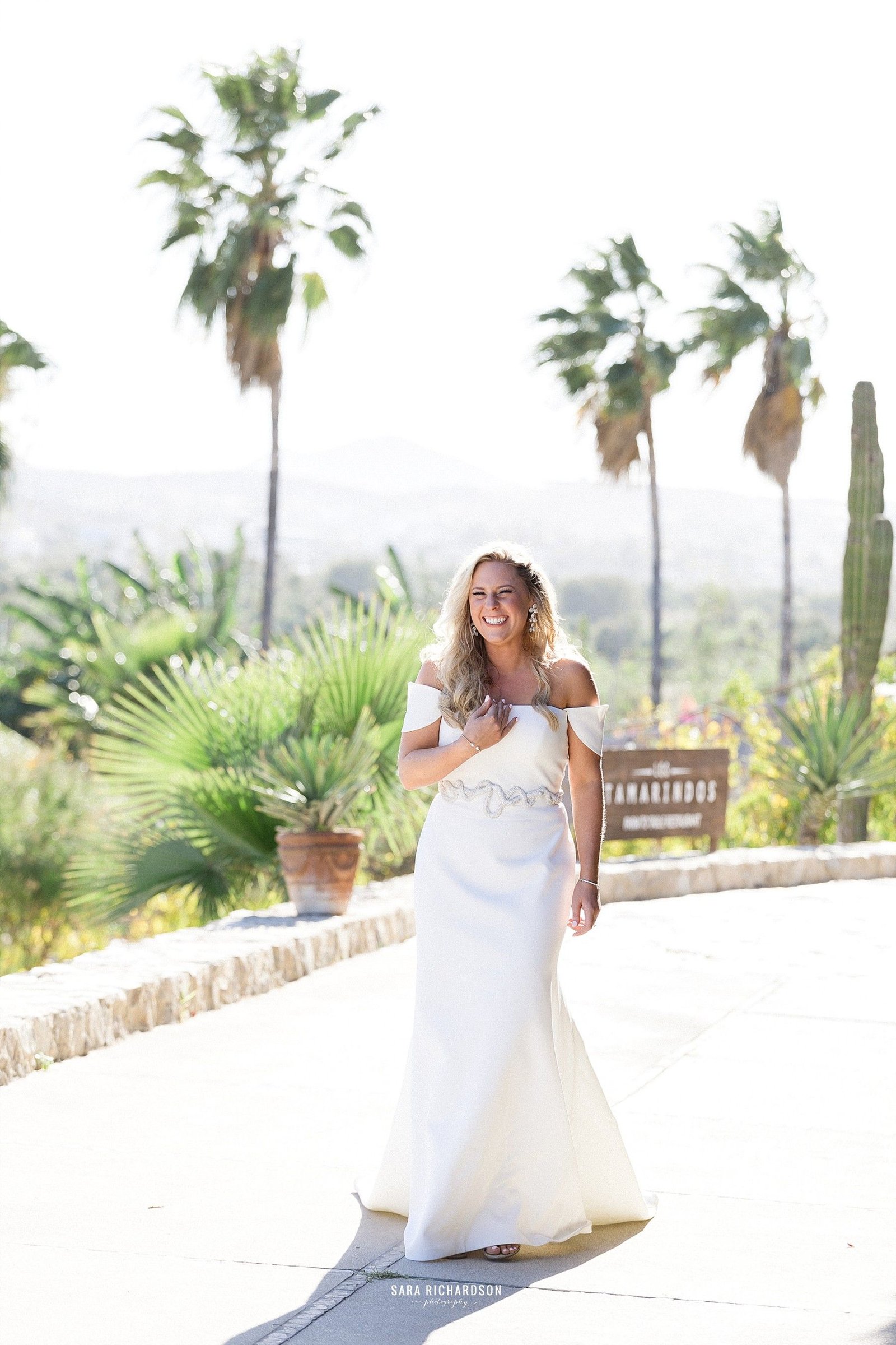 Bride very happy right after the ceremony. Beautiful scenery only in Los Cabos Mexico.