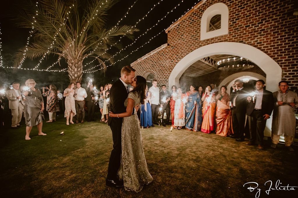 Bride and Groom kissing at First Dance at wedding venue in Cabo, Flora Farms.