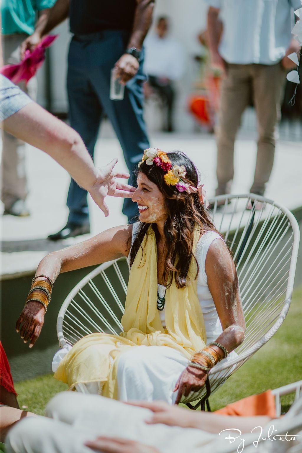 Bride getting turmeric on her during the Haldi Ceremony that took place in the morning at the Hilton Los Cabos. Cabo Wedding Services planned the whole Indian Wedding weekend.
