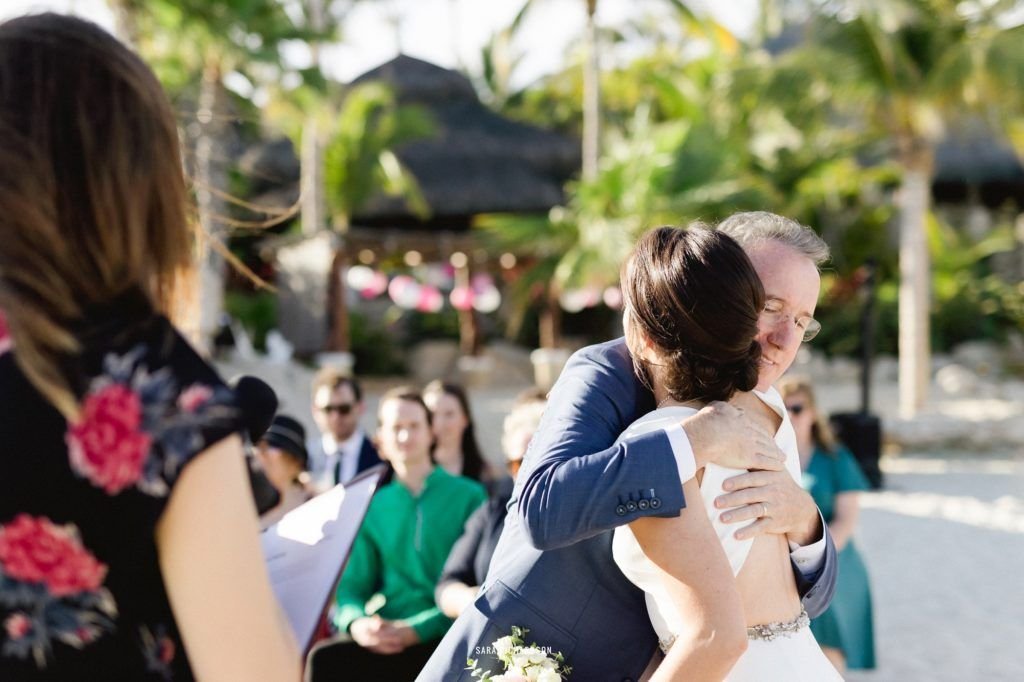 Father of the Bride hugging his daughter, giving her away to the man of her dreams, in Los Cabos Mexico.