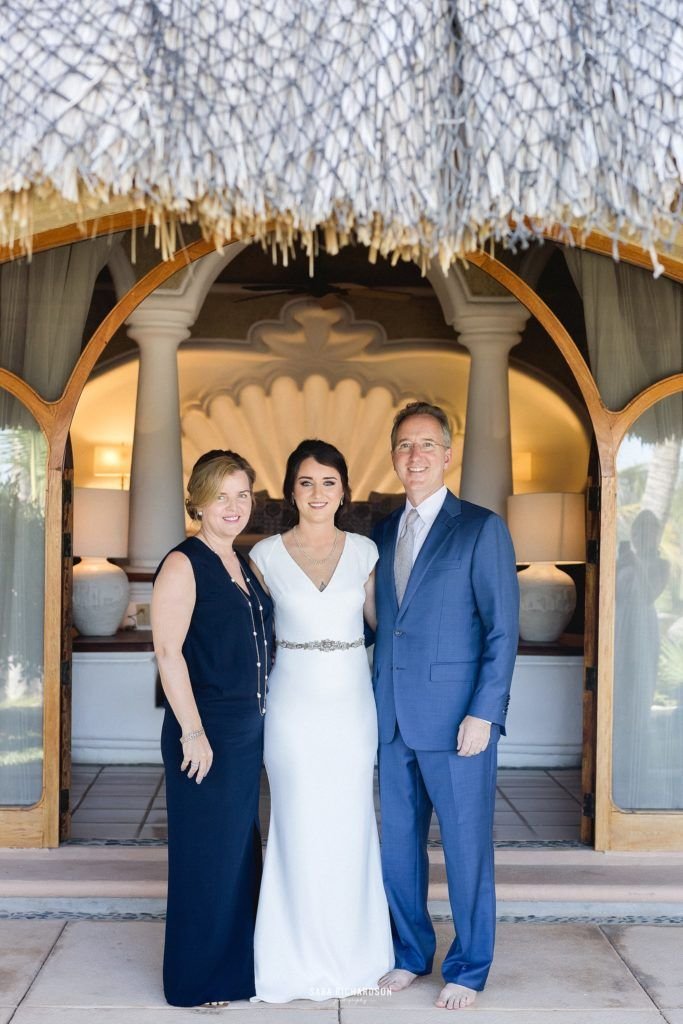 The Bride with her Mom and Dad minutes before walking down the aisle to her ceremony. She was so close with her parents, and definitely a daddy's girl. She looked amazing. She hired Cabo Wedding Services as her wedding planner and Sara Richardson photography to capture such amazing photos.