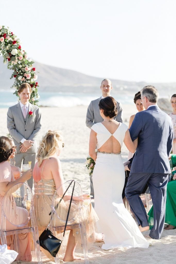 Bride almost arriving to her groom, where her dad would give her away. This was the perfect Destination Wedding in Los Cabos, Mexico.