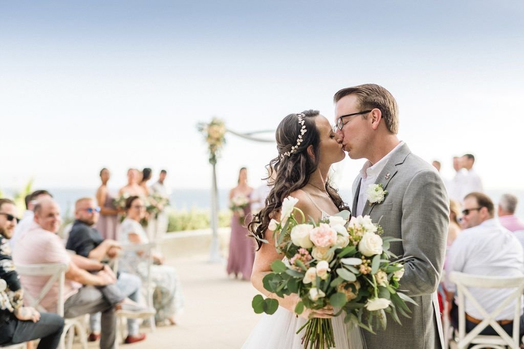 Bride and Groom's first kiss as husband and wife. Wedding took place at The Cape in Los Cabos Mexico. Wedding planning done by Jesse Wolff at Cabo Wedding Services in Los Cabos Mexico.