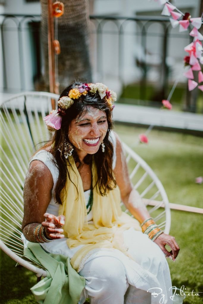 Bride covered in Turmeric at her Haldi event in Los Cabos, Mexico