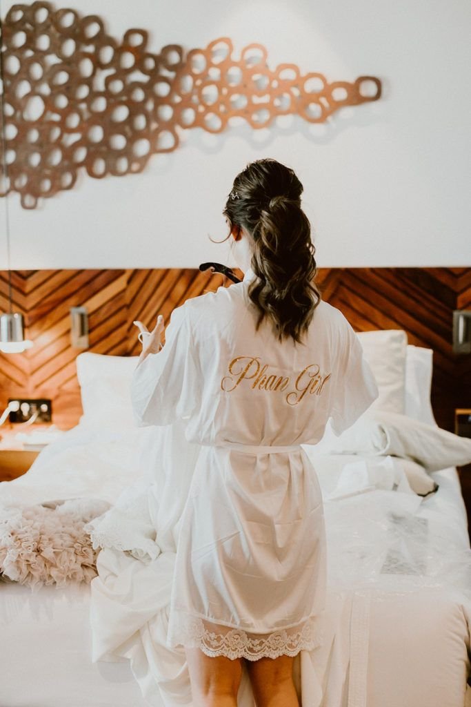 Our bride, Alexa, had a personalized robe made to say her future last name. Wedding photography was done by Ana and Jerome, wedding venue was Solaz Luxury Resorts and wedding planning was done by Cabo Wedding Services