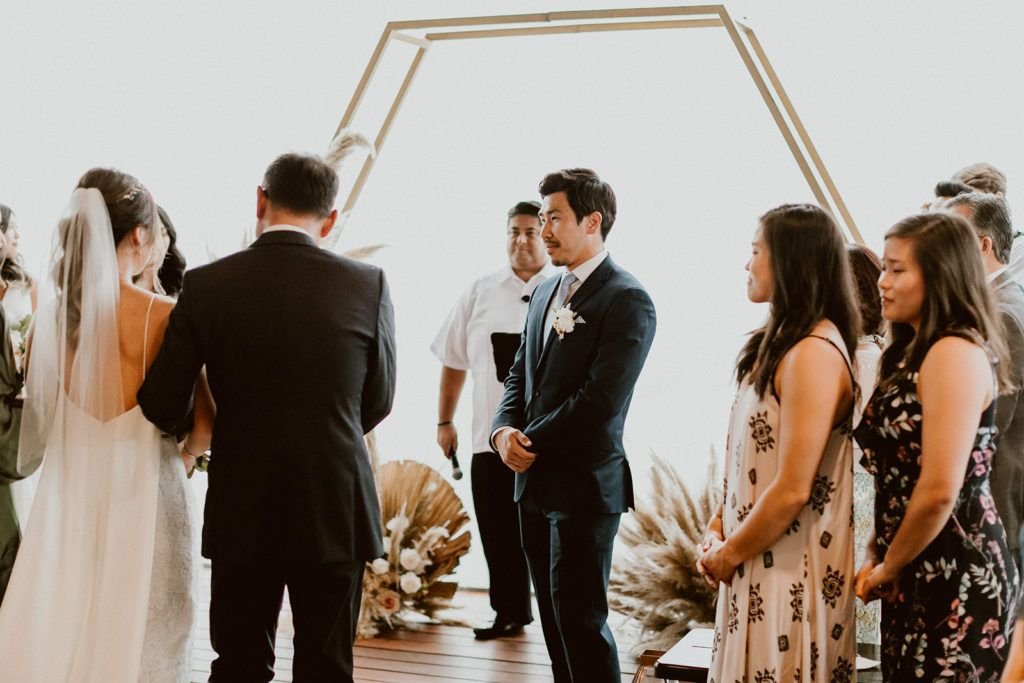 Groom waiting patient to hold his brides hand as the Ceremony begins