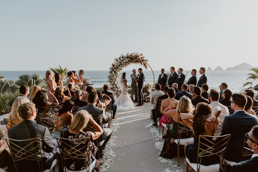 Wedding Ceremony at the Cape in Los Cabos Mexico. The bride and groom were saying their personal vows in this image. The officiant was from the US and they had a very intimate ceremony with 50 of their closest family and friends.