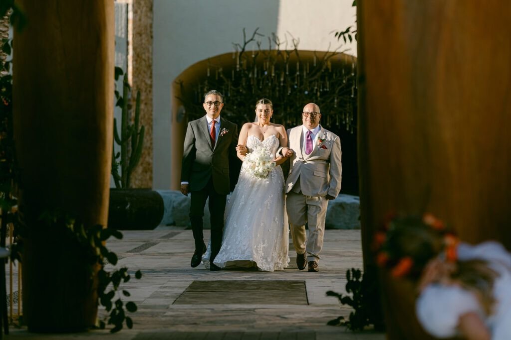 Bride walking down the aisle at her wedding at Waldorf Astoria planned by Cabo Wedding Services